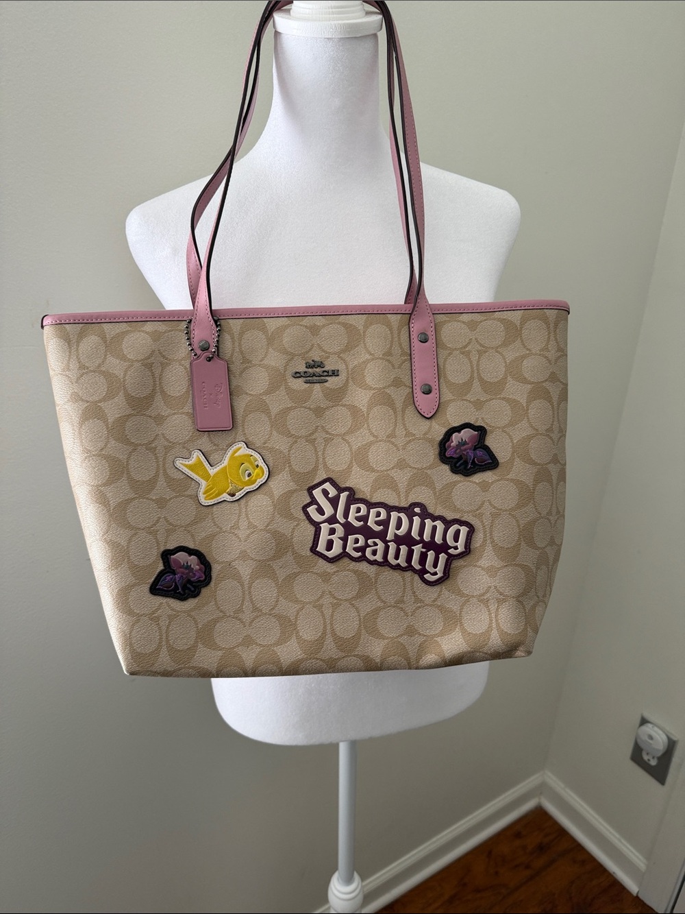Coach Beige Logo Tote with Pink Trim and Sleeping Beauty Patches